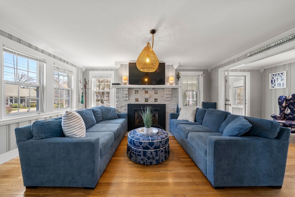 13 Hamilton Road Dennis, MA 02639 - Photo 6 of 40 a living room with furniture and a fireplace