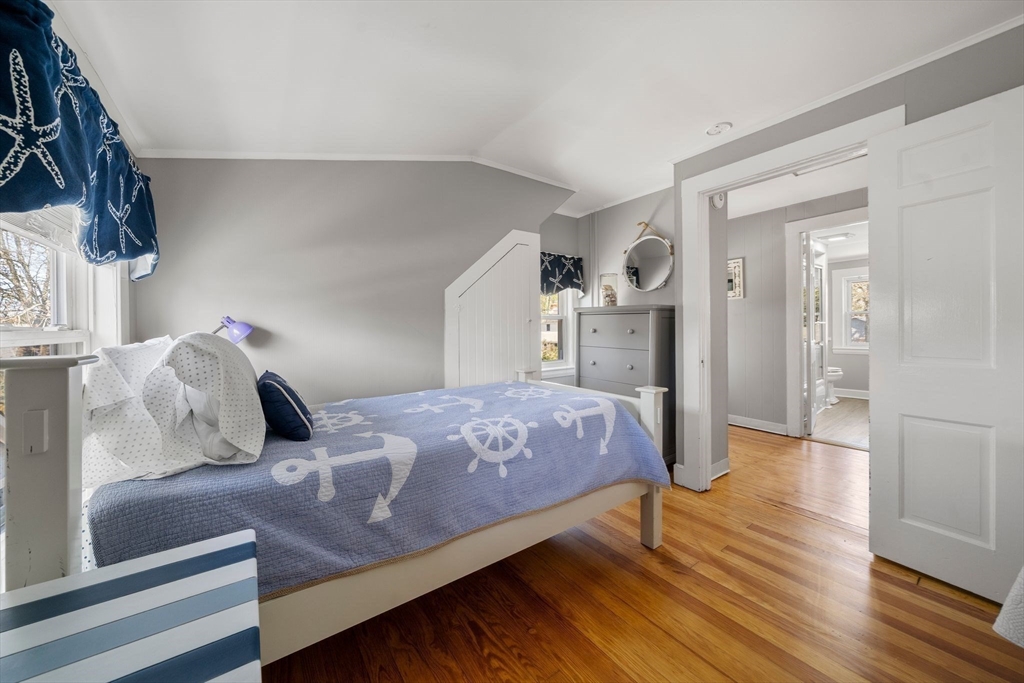 13 Hamilton Road Dennis, MA 02639 - Photo 8 of 40 a bedroom with a bed and wooden floor