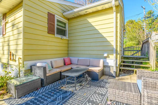 a outdoor living space with patio furniture and a potted plant
