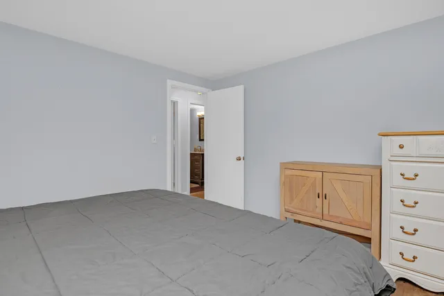 a view of an empty room and dresser