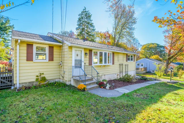 a front view of a house with a yard