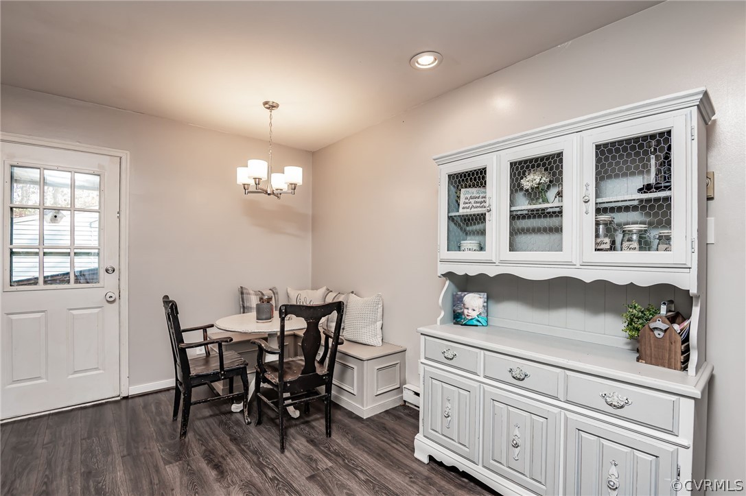 14406 Heather Stone Drive Chester, VA 23836 - Photo 11 of 29 a view of a dining room with furniture and chandelier