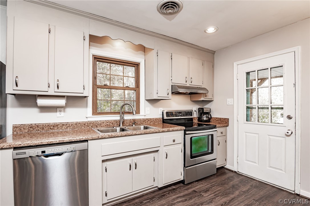 14406 Heather Stone Drive Chester, VA 23836 - Photo 12 of 29 a kitchen with stainless steel appliances granite countertop a sink stove and cabinets