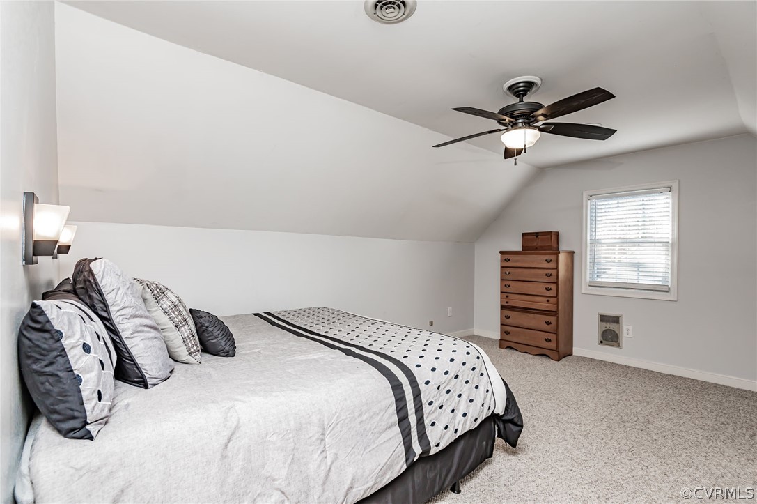 14406 Heather Stone Drive Chester, VA 23836 - Photo 21 of 29 a bedroom with a bed and a ceiling fan