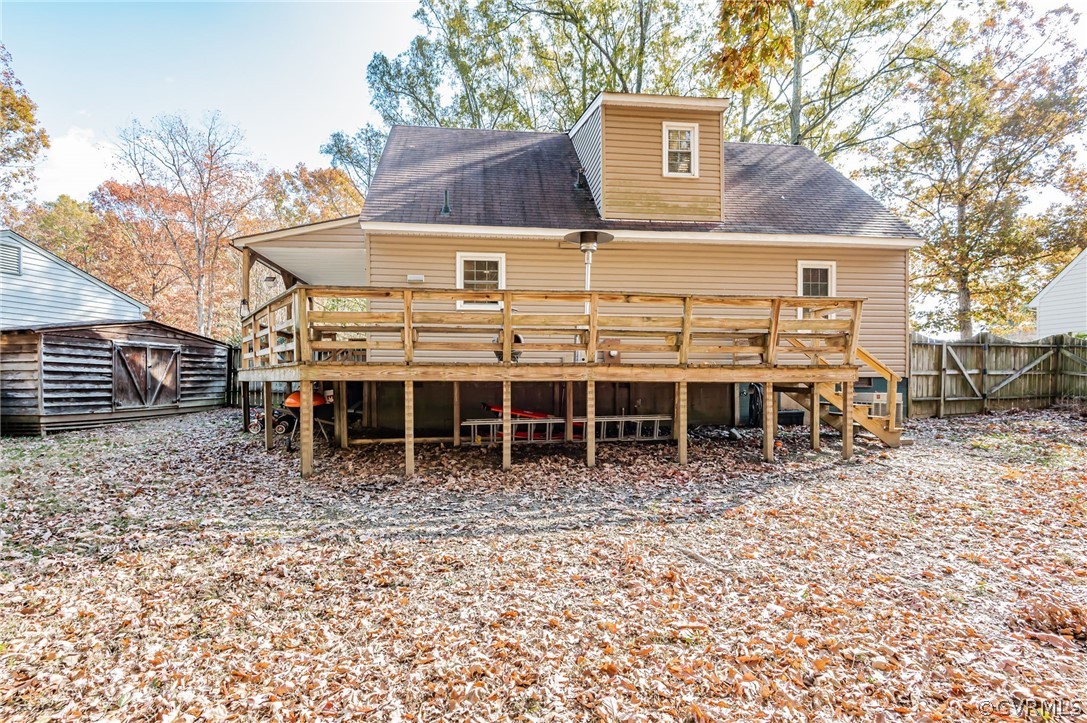 14406 Heather Stone Drive Chester, VA 23836 - Photo 27 of 29 a view of a house with a yard and wooden fence