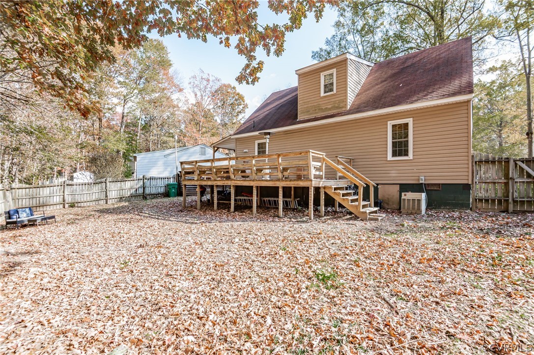 14406 Heather Stone Drive Chester, VA 23836 - Photo 28 of 29 a backyard of a house with table and chairs