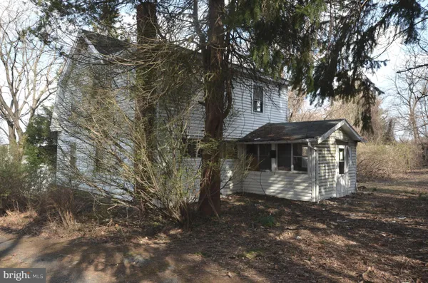 a view of a house with a tree