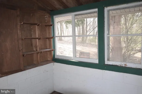 a view of a room with a large window