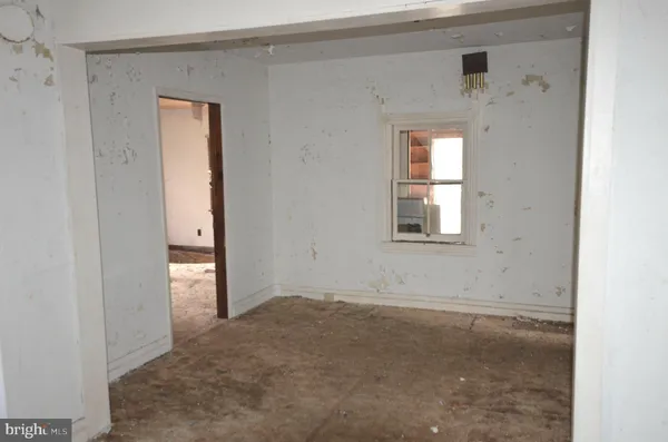 an empty room that has a window