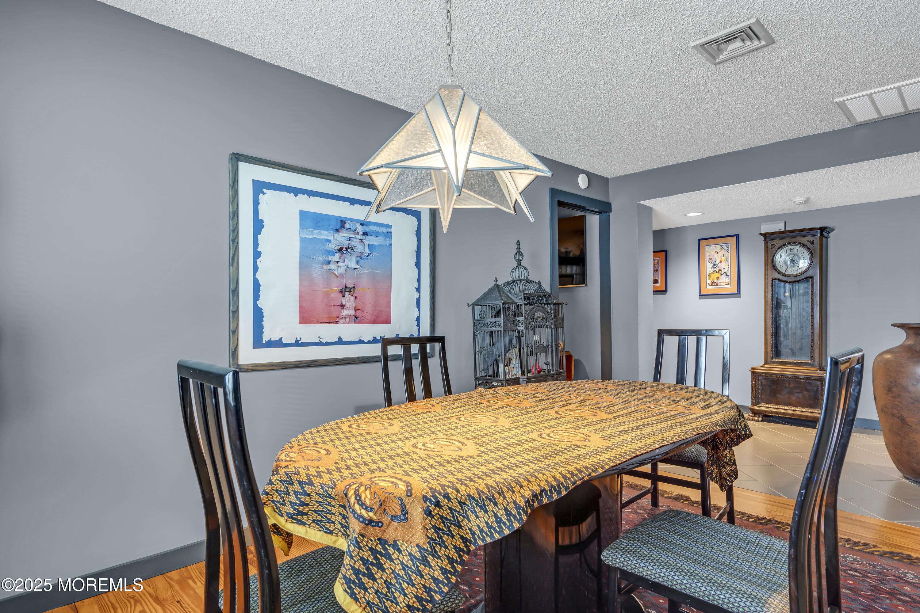Boulevard, Unit 18 Seaside Park, NJ 08752 - Photo 11 of 60 a dining room with a table and chairs