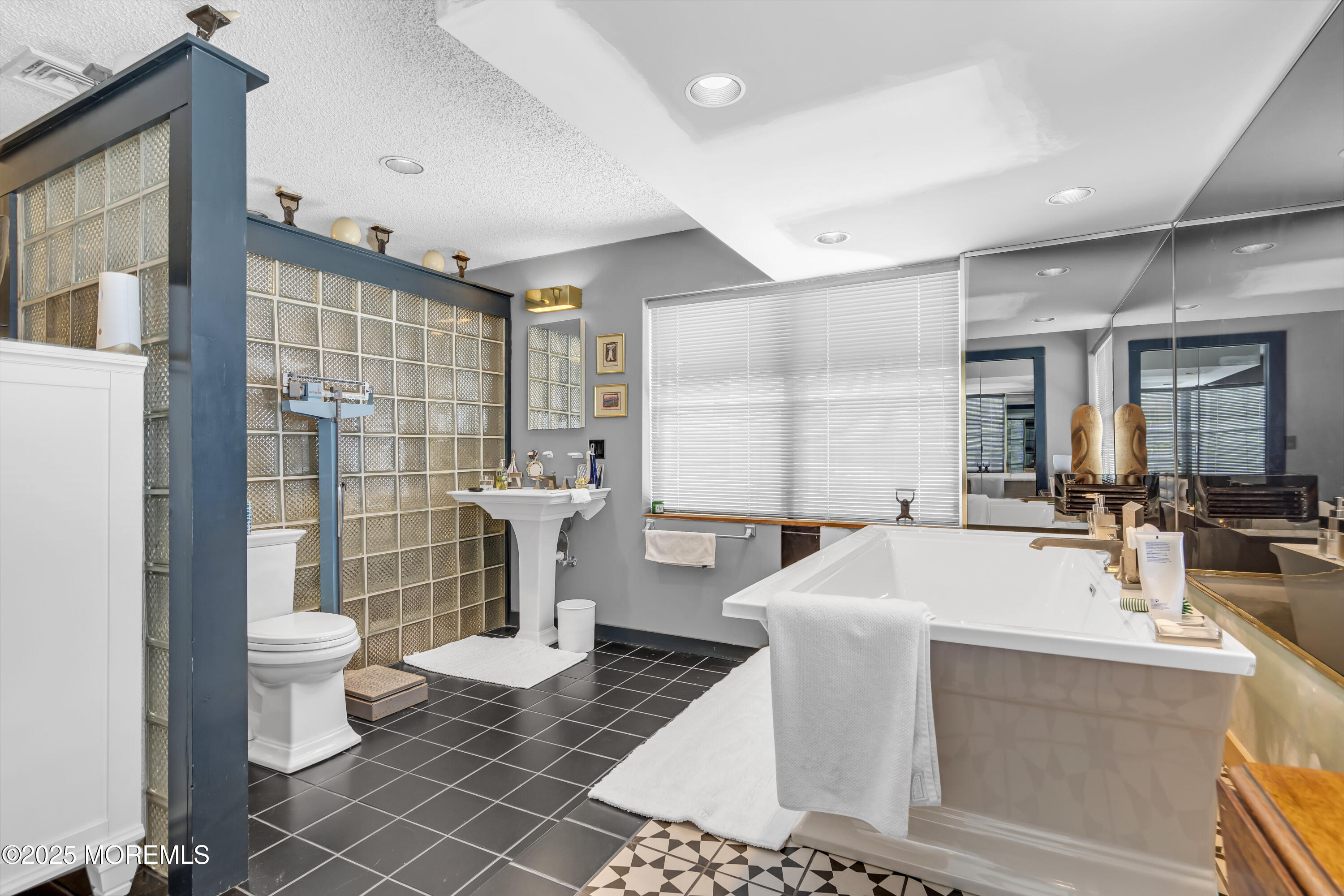 Boulevard, Unit 18 Seaside Park, NJ 08752 - Photo 13 of 60 a large white room with a washing machine and sink