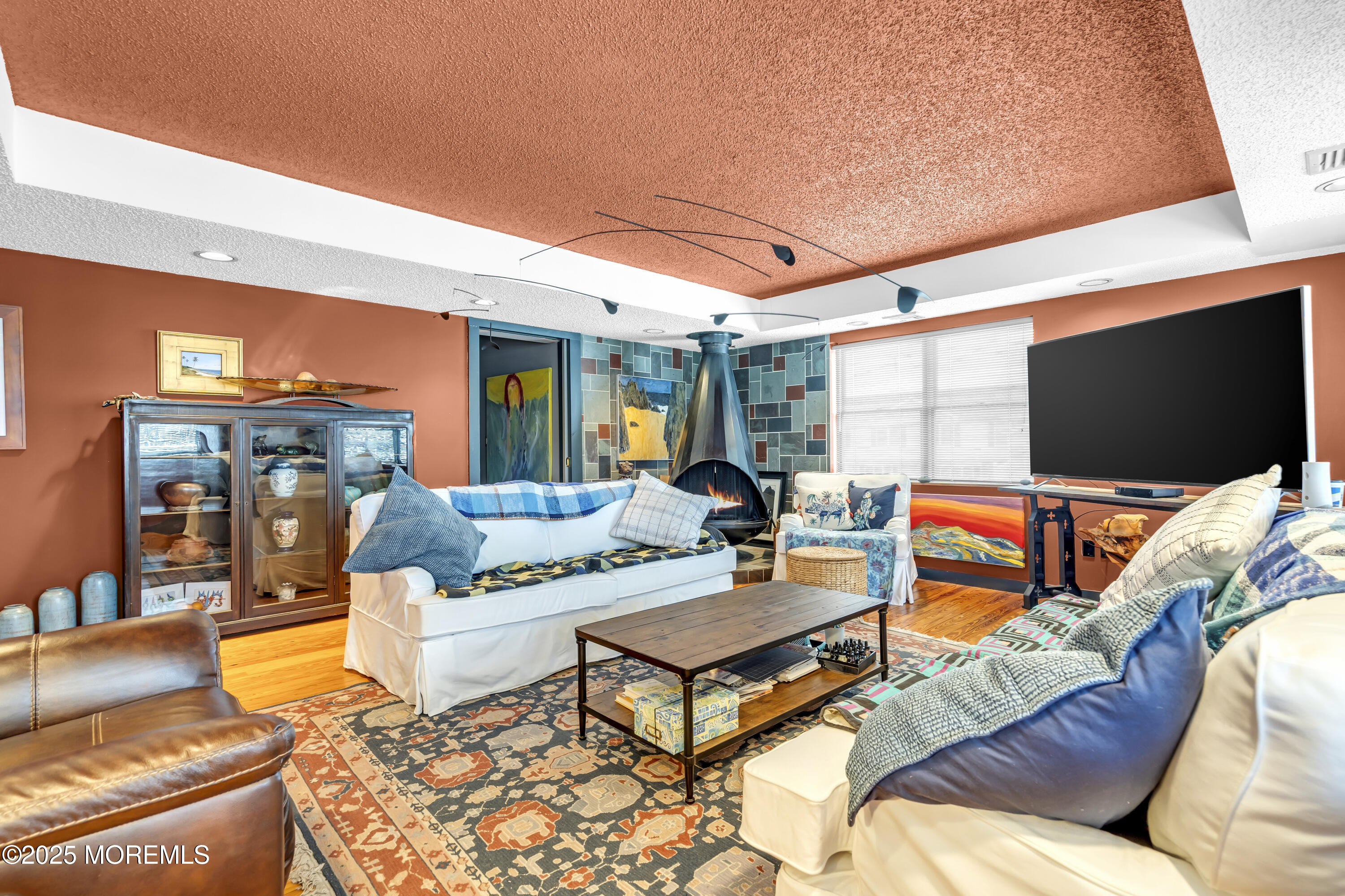 Boulevard, Unit 18 Seaside Park, NJ 08752 - Photo 16 of 60 a outdoor living space with furniture and a flat screen tv