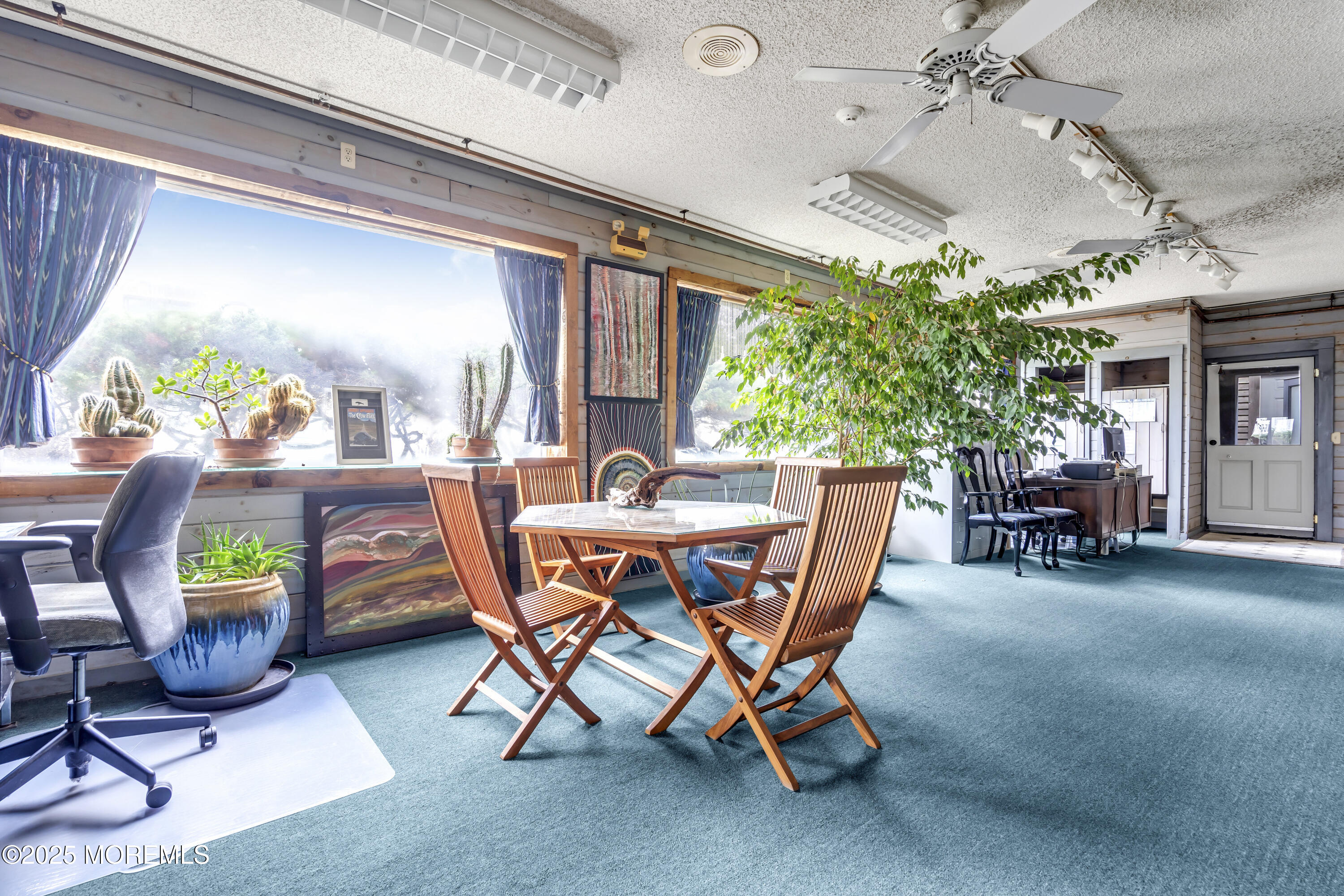 Boulevard, Unit 18 Seaside Park, NJ 08752 - Photo 25 of 60 a dining room with furniture and a floor to ceiling window