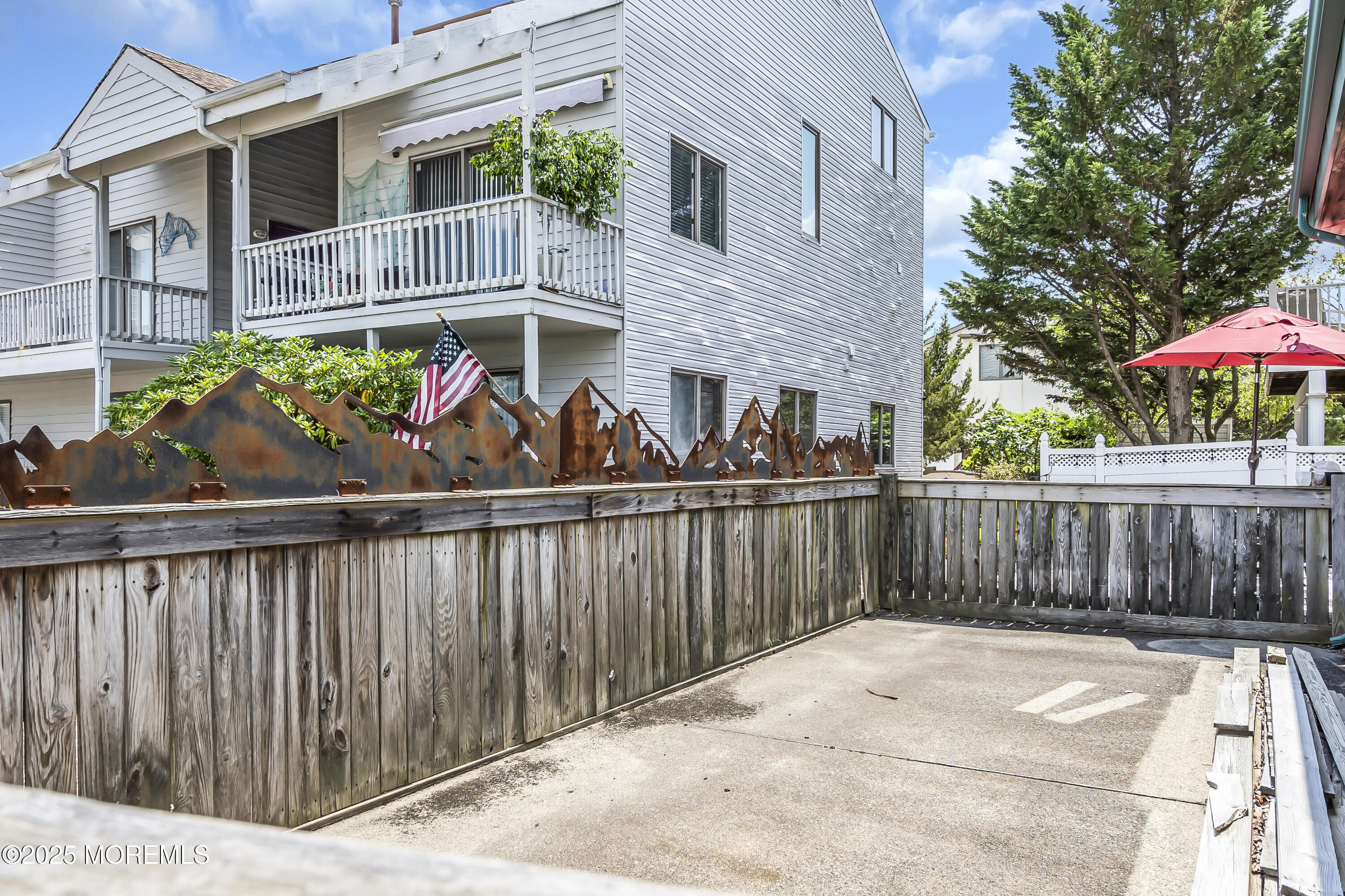 Boulevard, Unit 18 Seaside Park, NJ 08752 - Photo 30 of 60 a view of a house with wooden fence