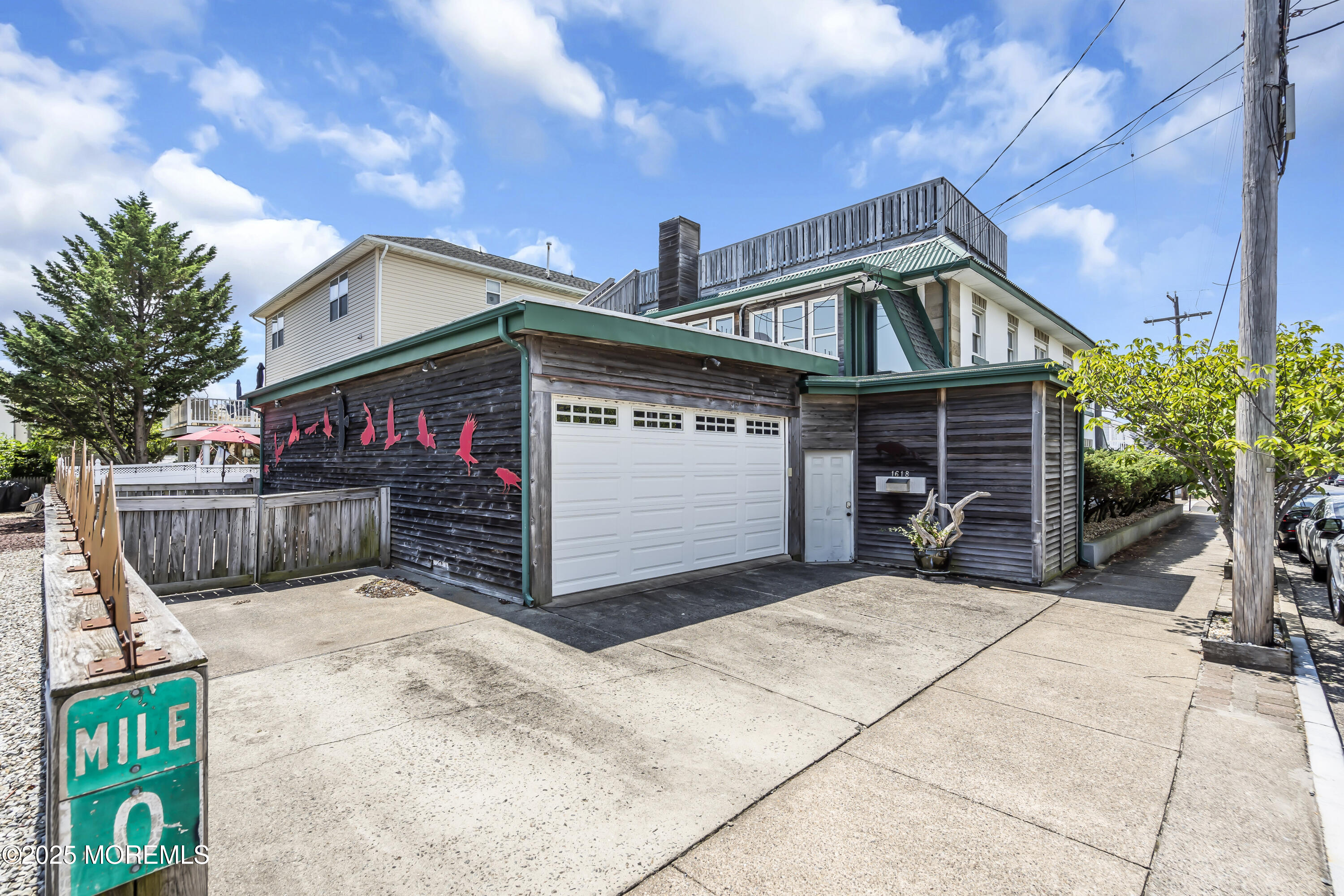 Boulevard, Unit 18 Seaside Park, NJ 08752 - Photo 5 of 60 a view of a house with large space and a car park in front of it