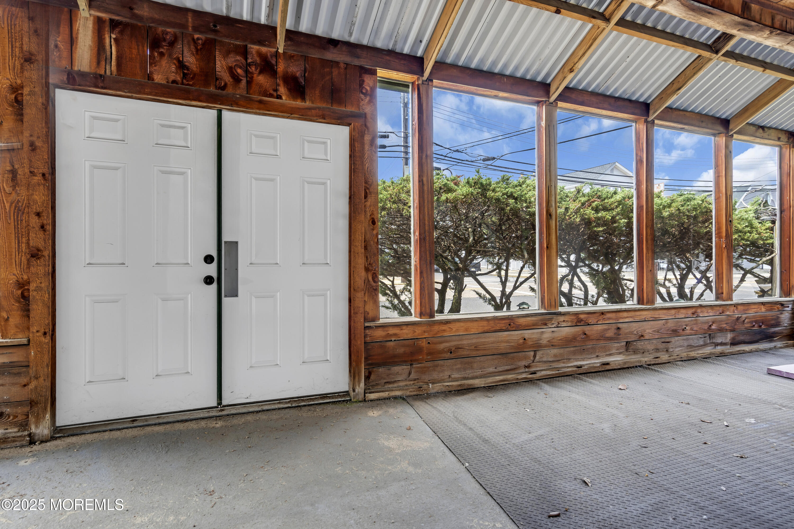 Boulevard, Unit 18 Seaside Park, NJ 08752 - Photo 6 of 60 an empty room with wooden floor and windows