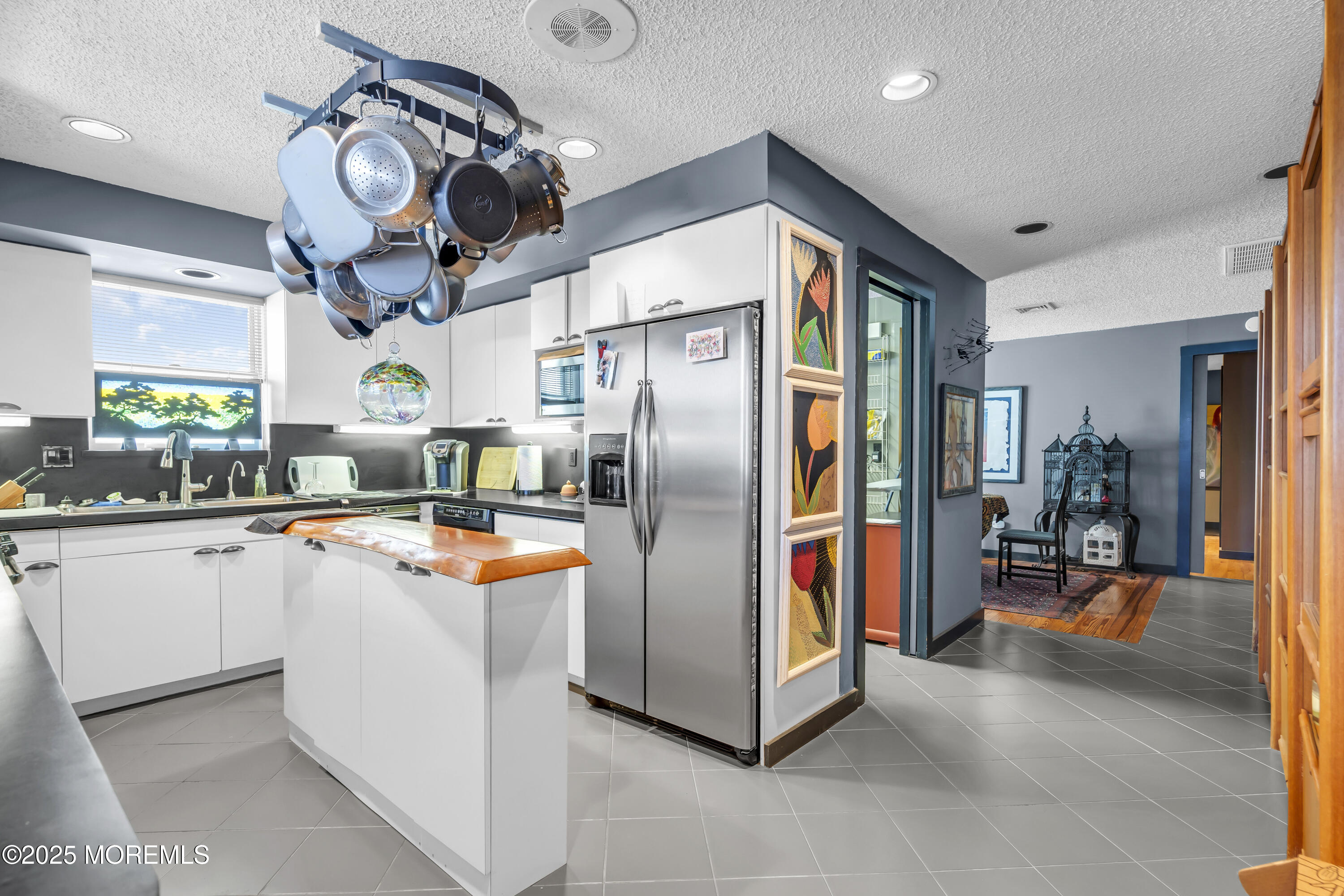 Boulevard, Unit 18 Seaside Park, NJ 08752 - Photo 8 of 60 a kitchen with stainless steel appliances granite countertop a refrigerator and microwave