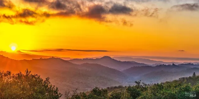 a view of an ocean with a mountain
