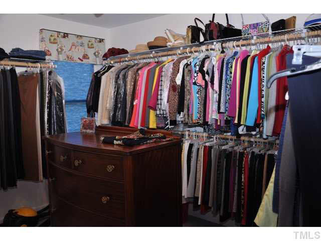 8904 Windjammer Drive Raleigh, NC 27615 - Photo 19 of 25 Yes, this really is a bedroom, but it serves the lady of the house well as a terrific closet!! :-) At buyers' request, owner will be glad to remove all hardware, repair walls and paint! Bedroom