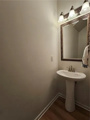 a bathroom with a sink and mirror
