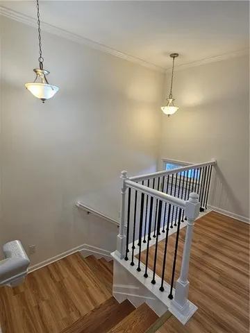 a view of a room with wooden floor