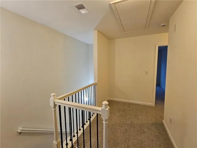a view of hallway with stairs