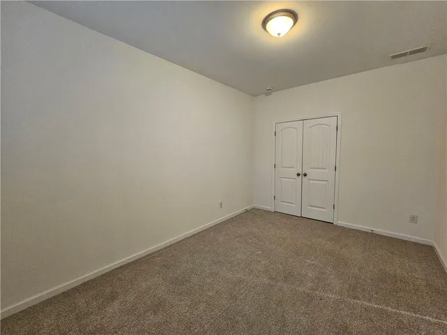 an empty room with a empty space and window