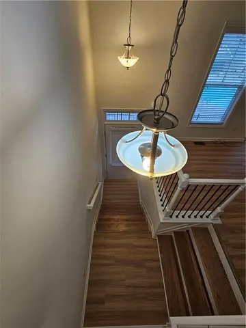 a balcony with table and chairs