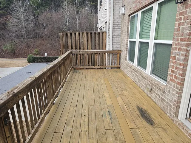 a view of balcony with wooden floor