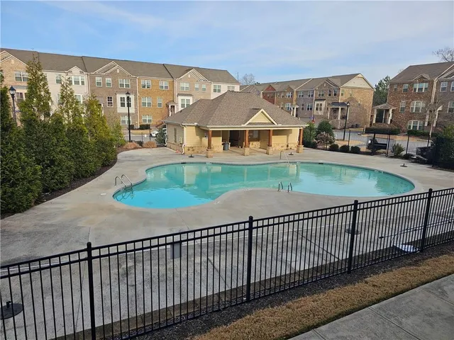 a view of a houses with a city from a balcony