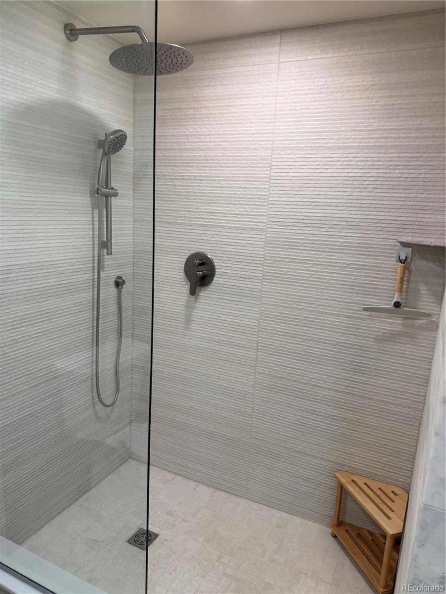 350 Detroit Street, Unit 209 Denver, CO 80206 - Photo 7 of 12 a bathroom with a shower