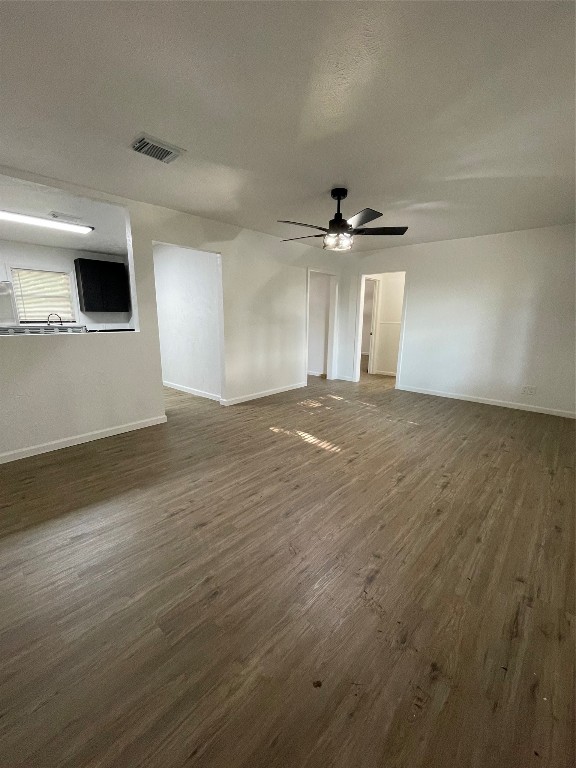 1119 Tobola Street Rosenberg, TX 77471 - Photo 5 of 14 a view of an empty room with a ceiling fan and window