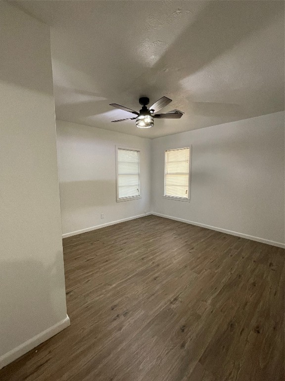 1119 Tobola Street Rosenberg, TX 77471 - Photo 8 of 14 an empty room with wooden floor and windows