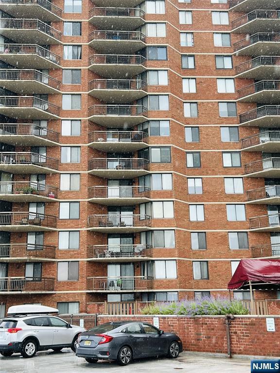 1040 Harmon Cove Tower, Unit 1040 Secaucus, NJ 07094 - Photo 13 of 15 a cars parked in front of a building