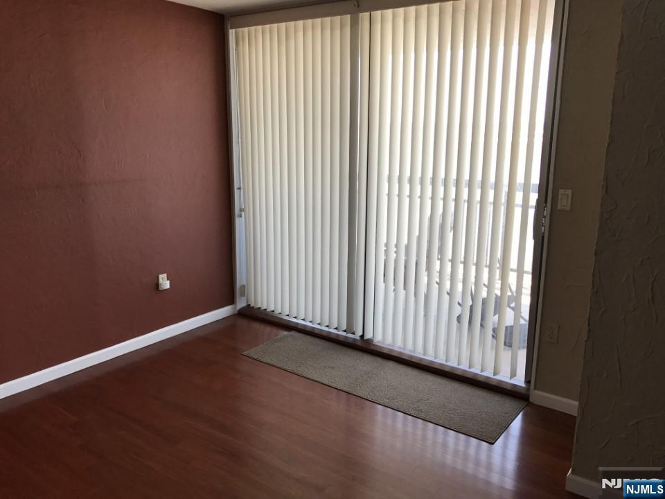 1040 Harmon Cove Tower, Unit 1040 Secaucus, NJ 07094 - Photo 2 of 15 a view of a small space with wooden floor