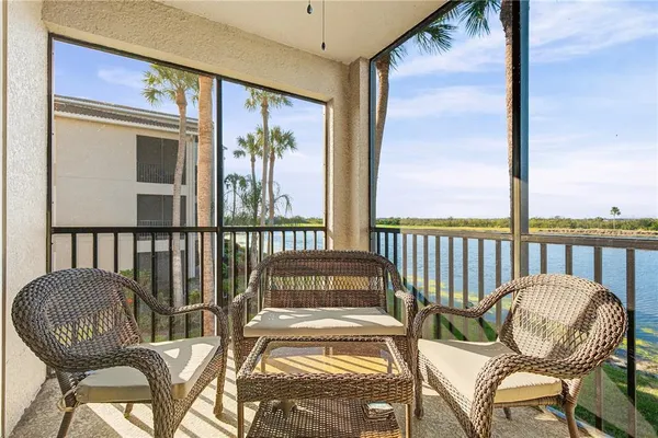 a view of a balcony with furniture