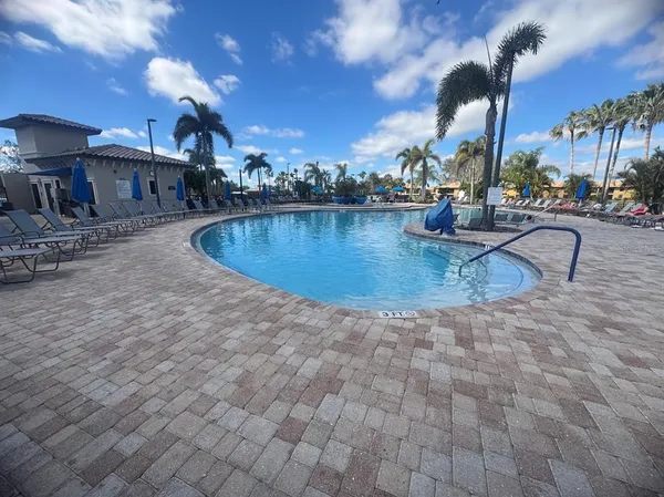 a view of a swimming pool with a patio