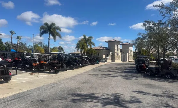 a view of a house with a yard and pathway