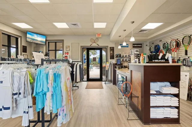 a bedroom with furniture large window and couch