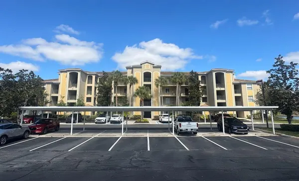a picture of a room with a white wall and a white refrigerator