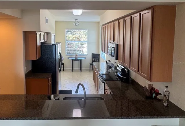a view of living room with furniture and window
