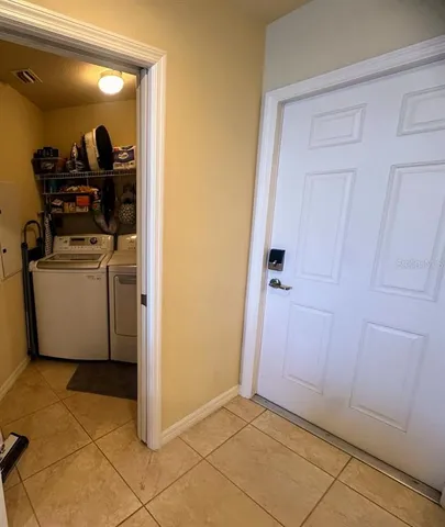 a view of a storage & utility room with washer and dryer