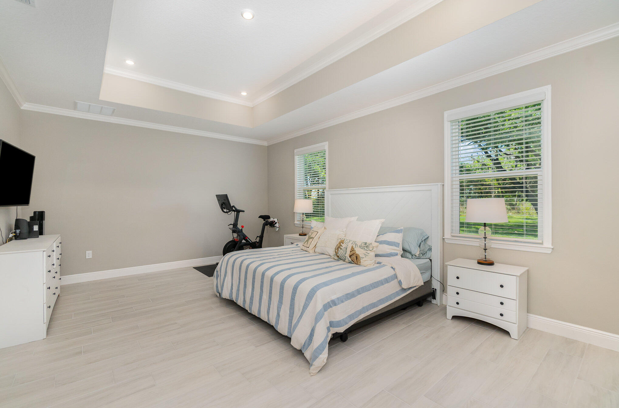 1780 Indria Lane Malabar, FL 32950 - Photo 14 of 35 a bedroom with a bed and a tv