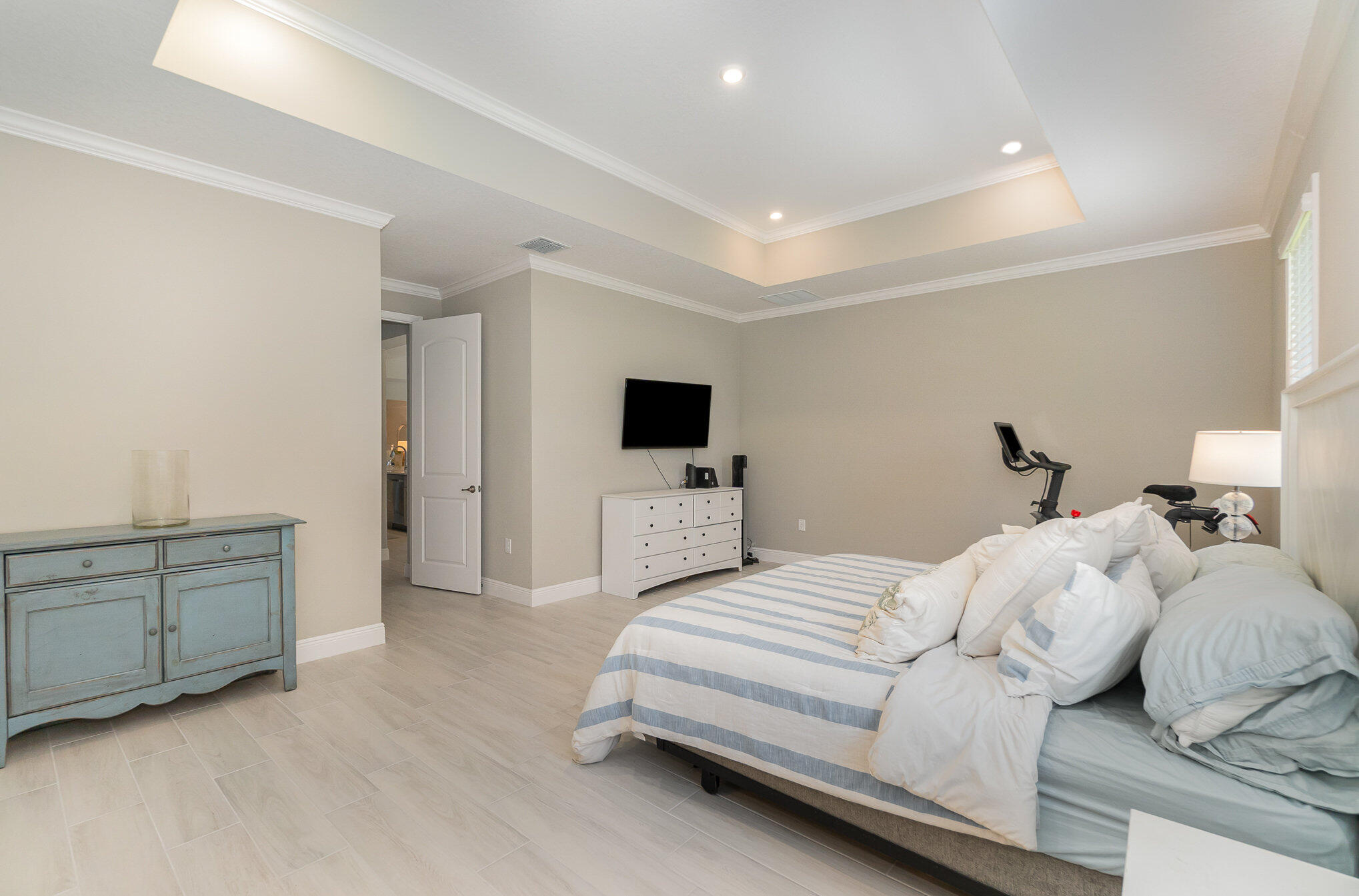 1780 Indria Lane Malabar, FL 32950 - Photo 15 of 35 a bedroom with a bed and a flat screen tv