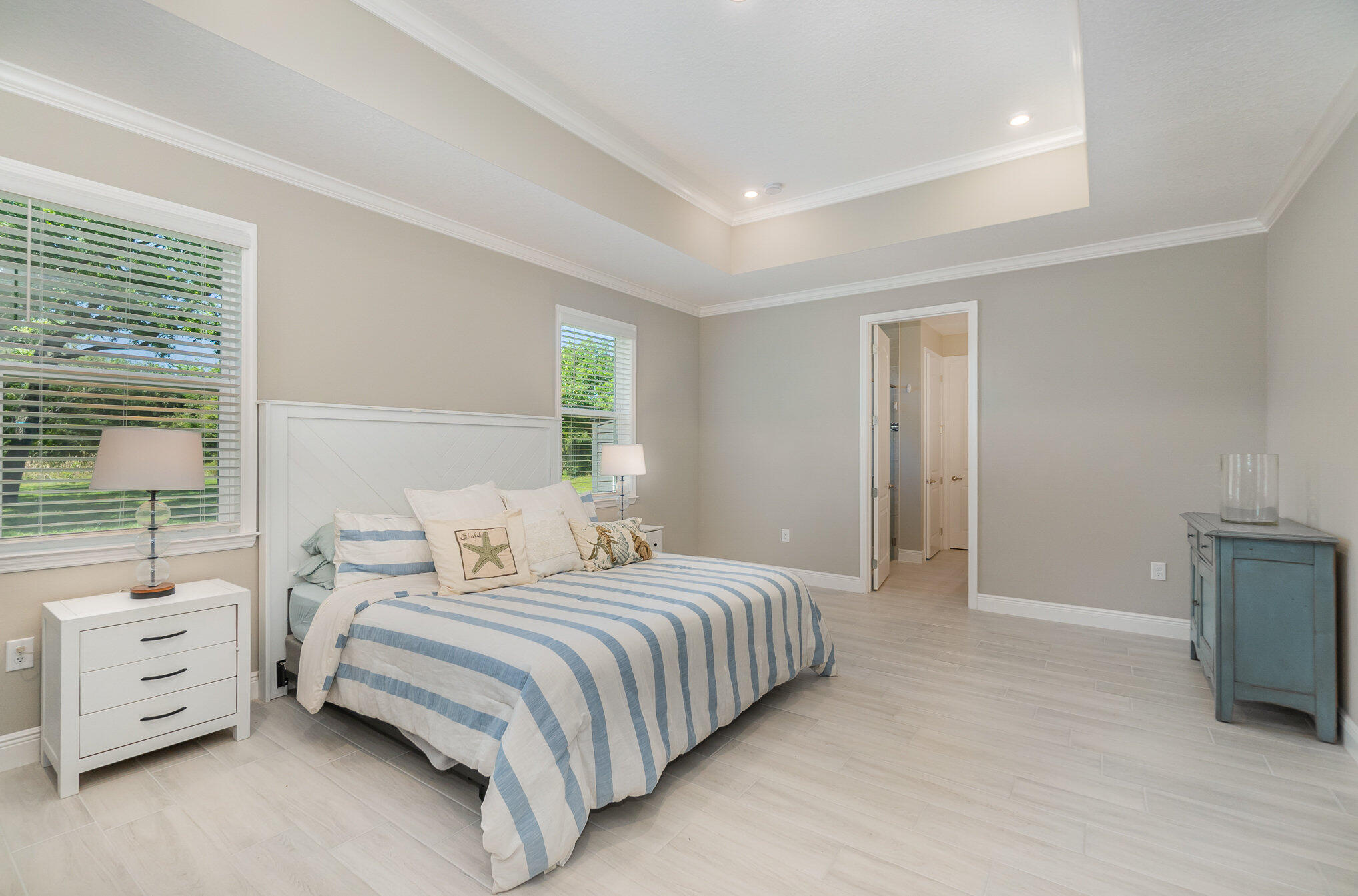 1780 Indria Lane Malabar, FL 32950 - Photo 16 of 35 a bedroom with a bed and a large window