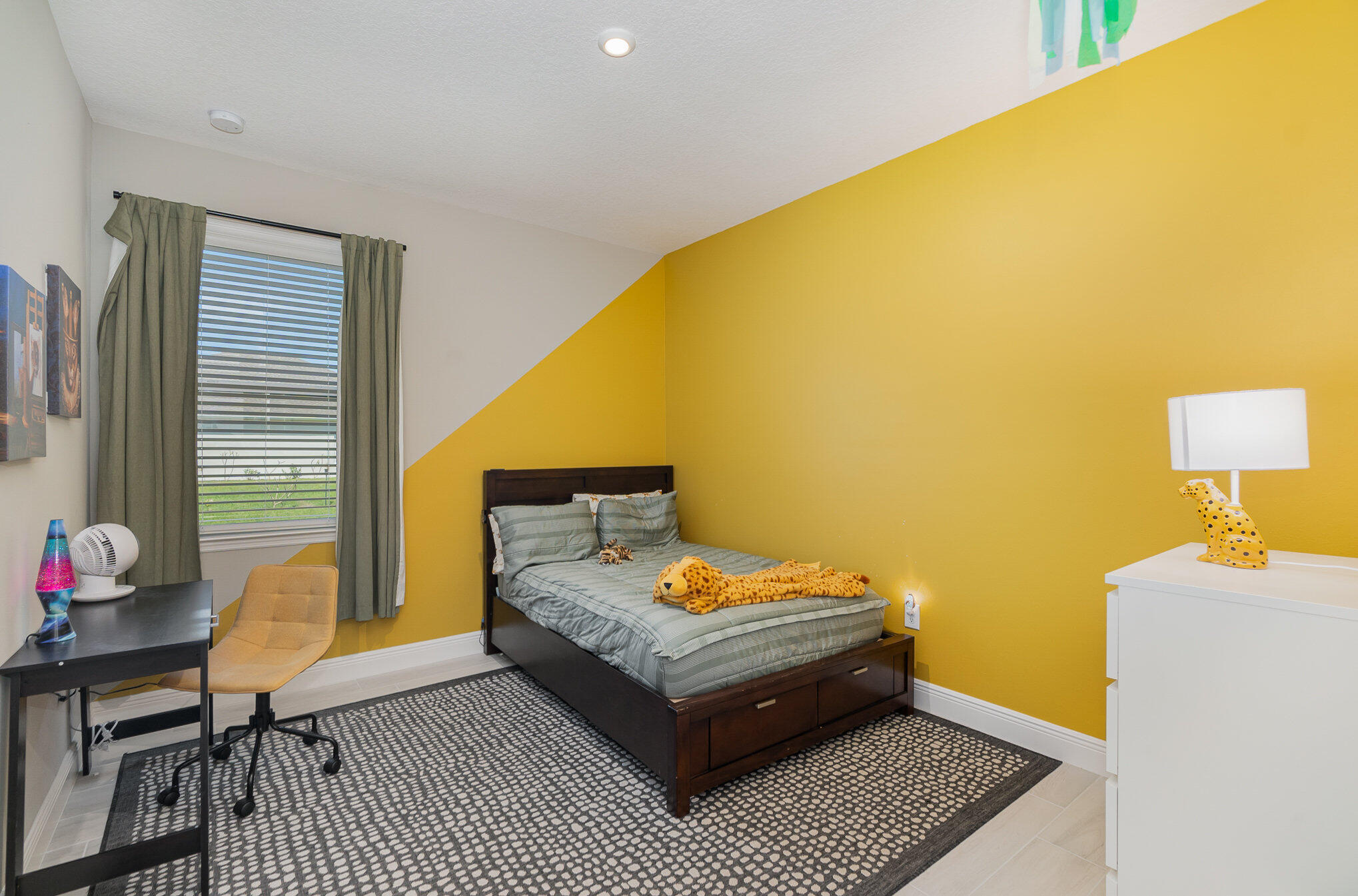 1780 Indria Lane Malabar, FL 32950 - Photo 19 of 35 a bedroom with a bed and wooden floor