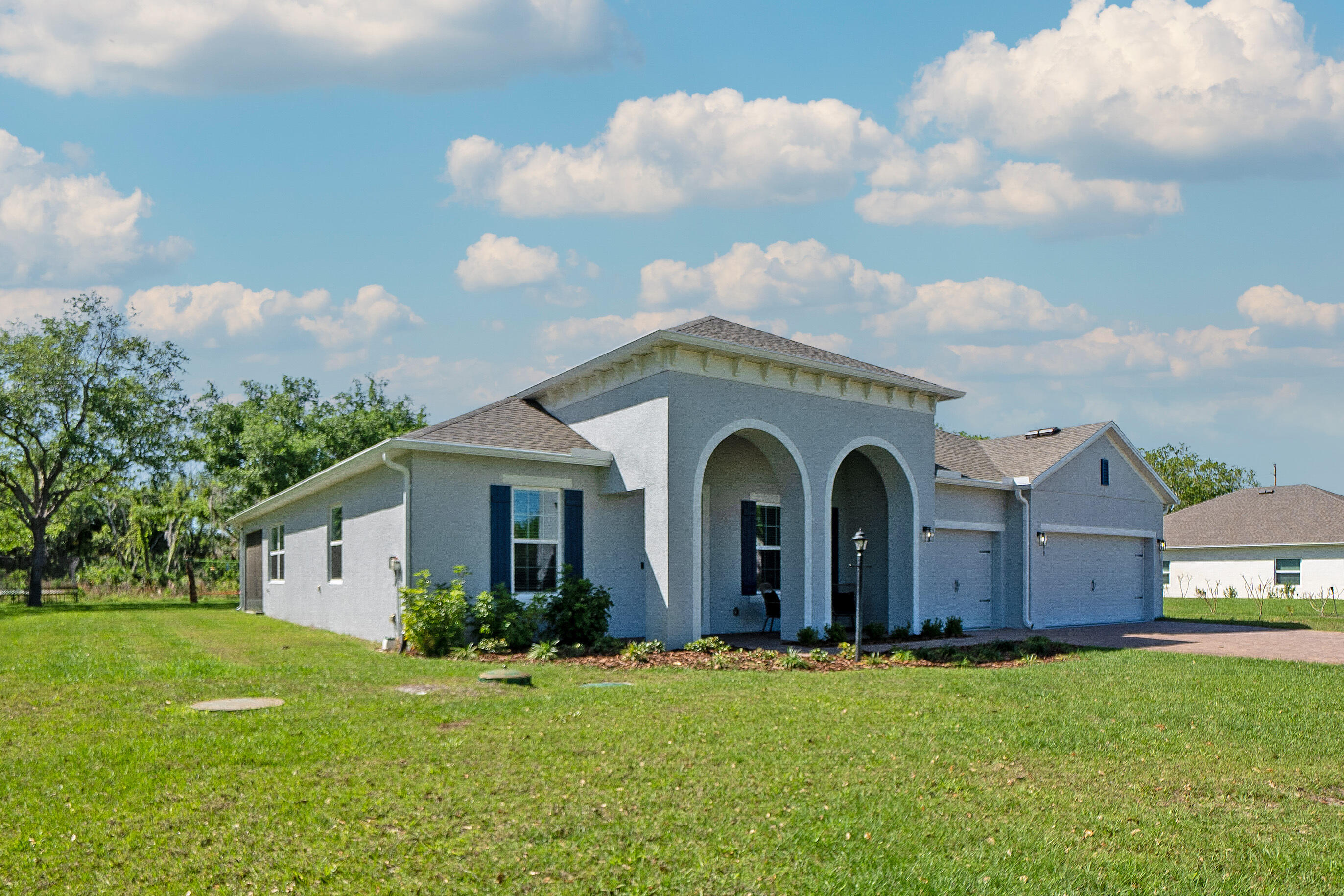 1780 Indria Lane Malabar, FL 32950 - Photo 2 of 35 a front view of a house with garden