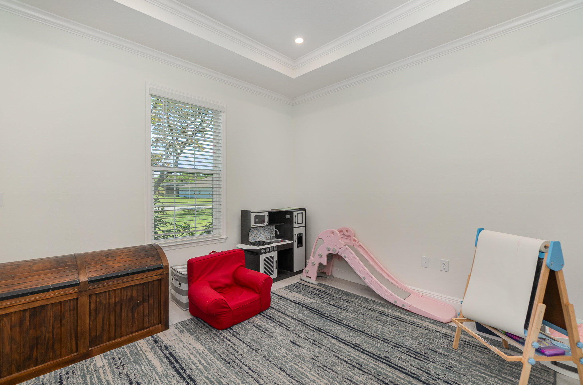 1780 Indria Lane Malabar, FL 32950 - Photo 24 of 35 a bedroom with a bed and wooden floor