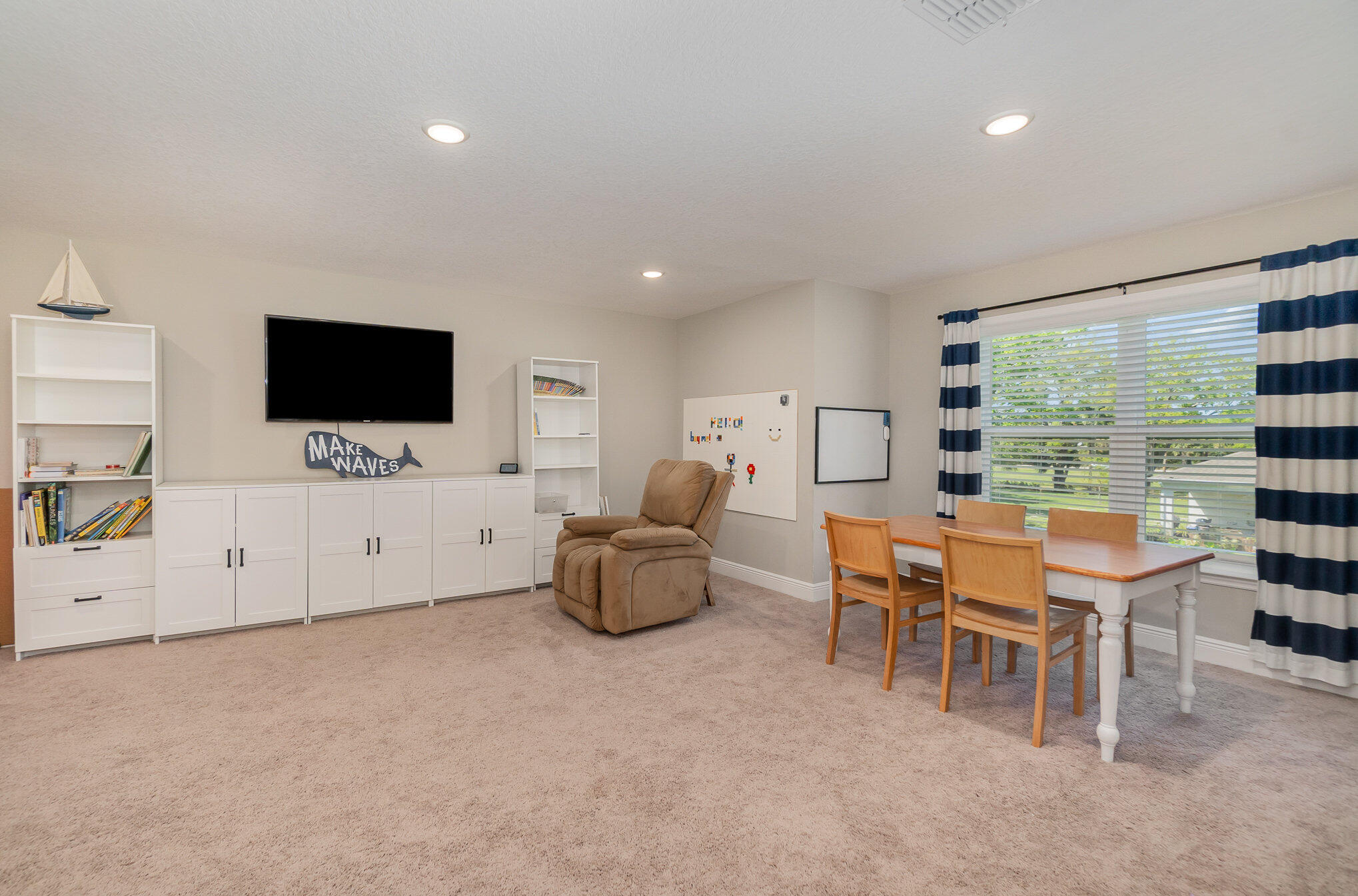 1780 Indria Lane Malabar, FL 32950 - Photo 26 of 35 a living room with furniture and a flat screen tv