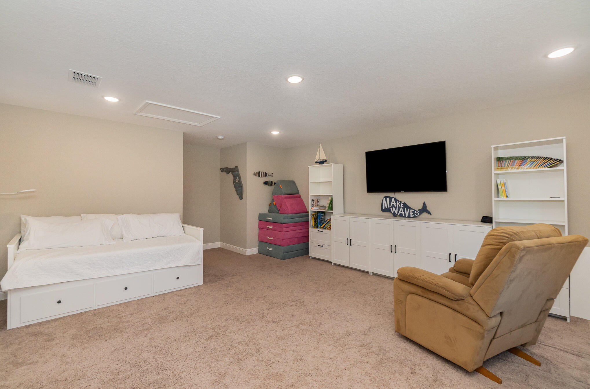 1780 Indria Lane Malabar, FL 32950 - Photo 27 of 35 a living room with furniture and a flat screen tv